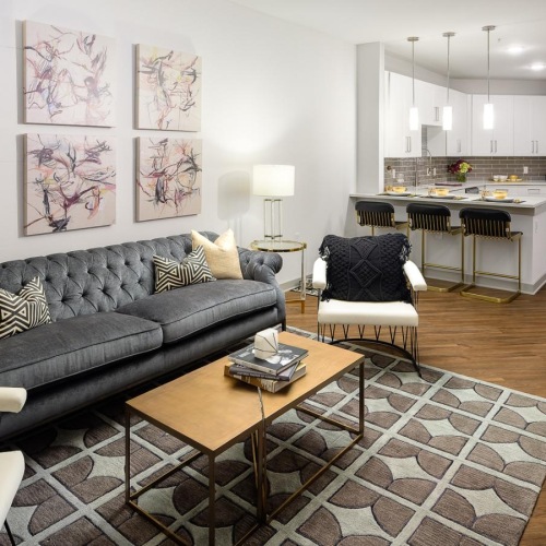 a living room with a couch and a table