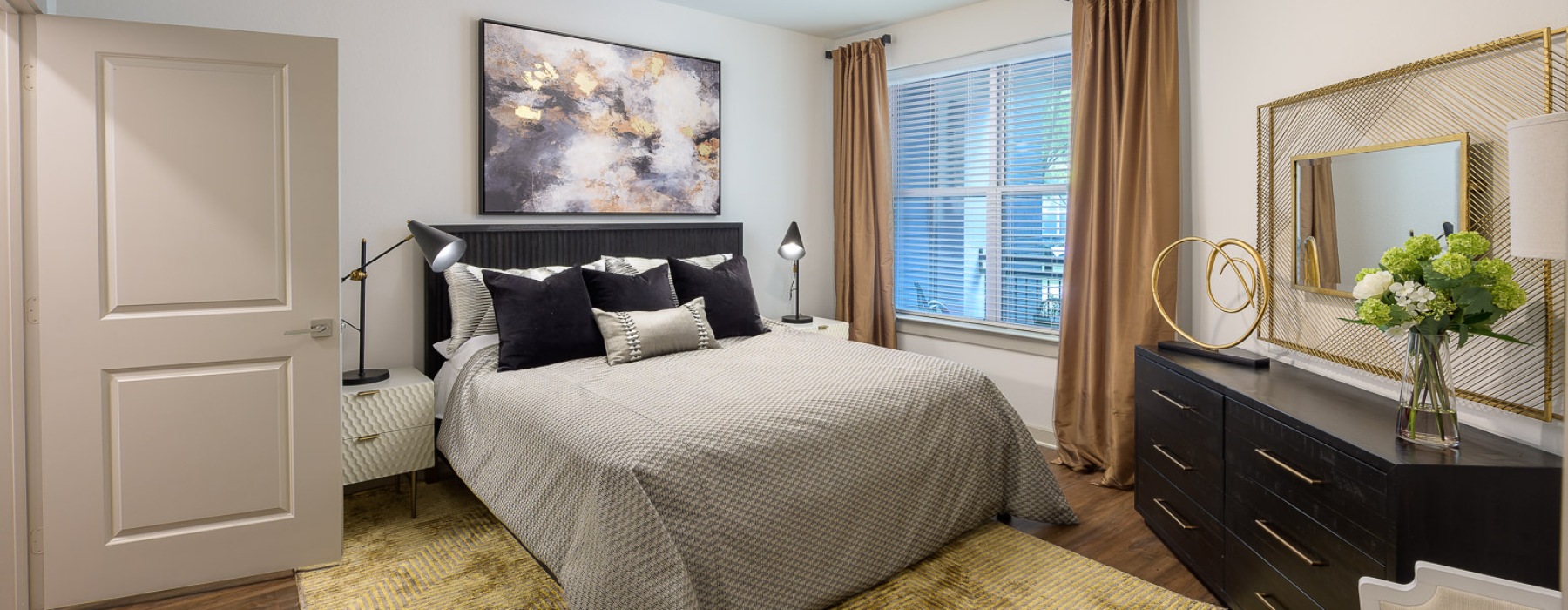 a bedroom with a bed and a dresser