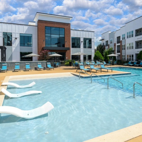 swimming pool with in-pool loungers